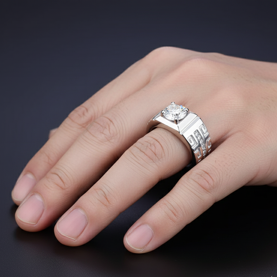 Hand wearing a silver ring with a diamond on a dark background